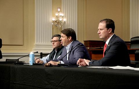 Standing at a podium