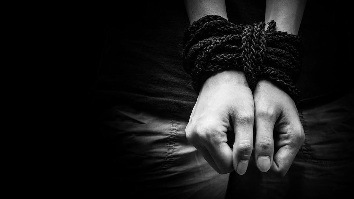 A person's hands are tied